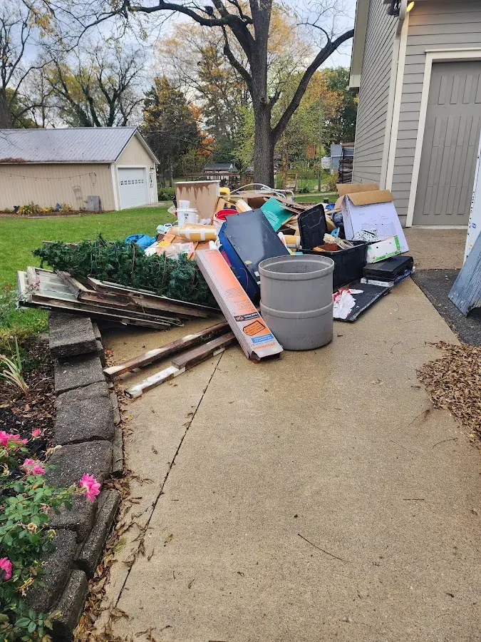 Dumpster being loaded with debris for 10 Yard Dumpster Rental in Groesbeck